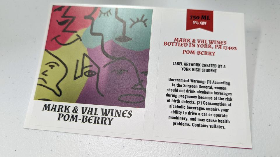 Pom-Berry wine features a label with art made by a York High Student. Mark Rhodes paid the student for her work,