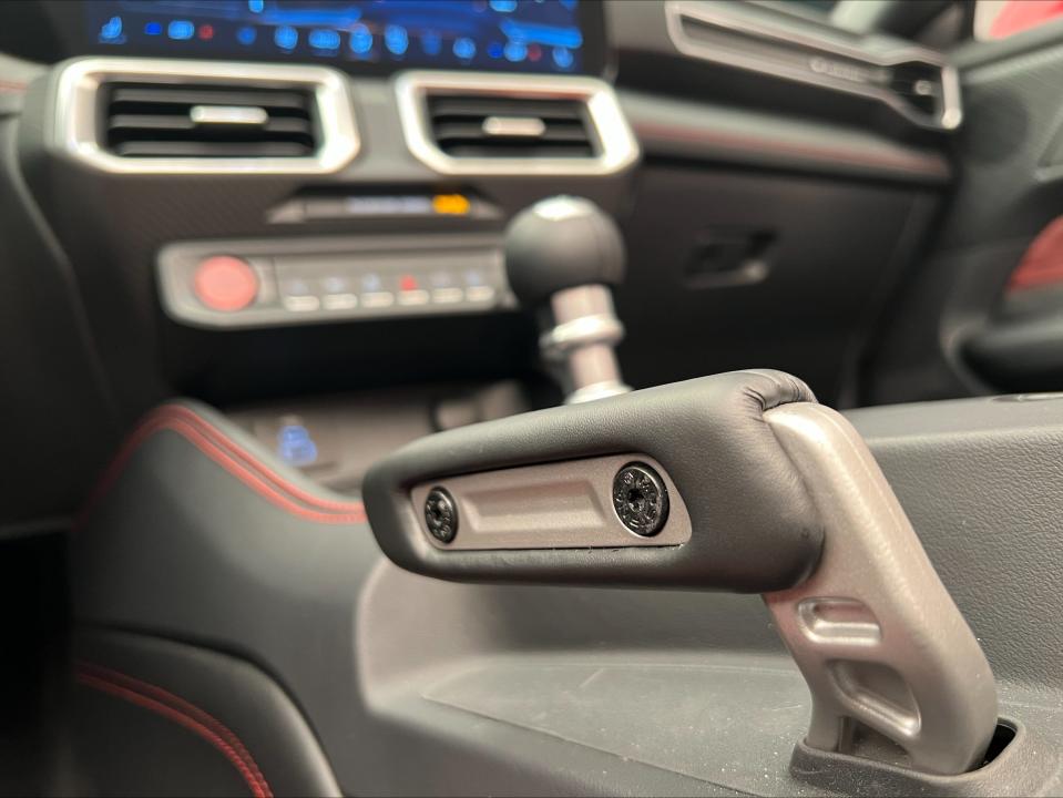 The Performance Electronic Parking Brake, shown here, comes standard with the Performance Pack on all 2024 Ford Mustang models. It's designed by Formula Drift champion Vaughn Gittin Jr., along with pro driver Chelsea DeNofa, for Ford.