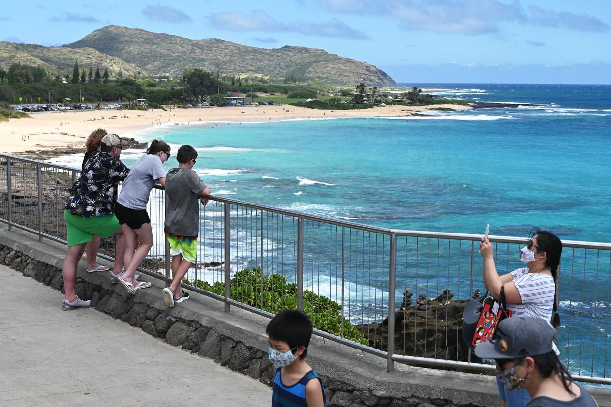 People look at Sandy Beach, on the south shore of Oahu, Hawaii,