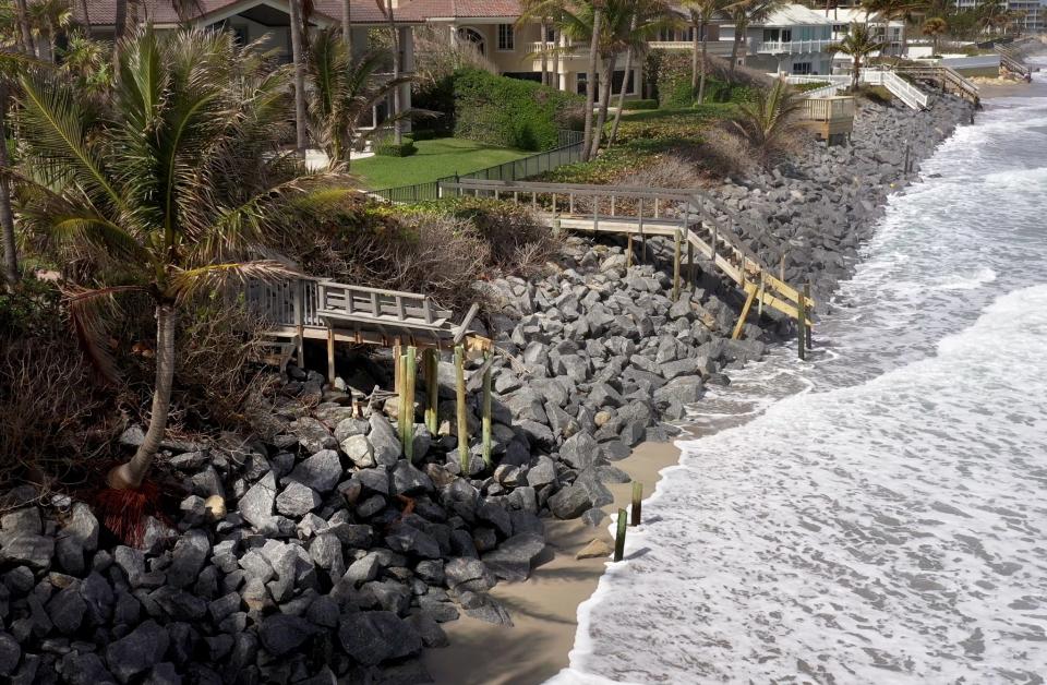 Stairs to the beach are damaged and sand eroding on February 12, 2024, in Jupiter Inlet Colony, Florida.
