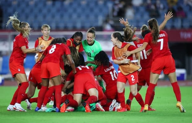 Team Canada celebrates after a thrilling women's soccer quarter-final win over Brazil in penalty kicks. (Koki Nagahama/Getty Images - image credit)