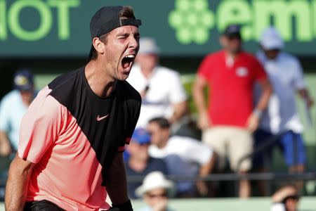 Mar 24, 2018; Key Biscayne, FL, USA; Thanasi Kokkinakis of Australia celebrates after match point against Roger Federer of Switzerland (not pictured) on day five of the Miami Open at Tennis Center at Crandon Park. Kokkinakis won 3-6, 6-3, 7-6(4). Mandatory Credit: Geoff Burke-USA TODAY Sports