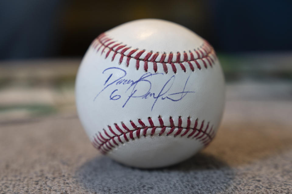 A baseball signed by Major League Baseball player David Peralta is seen at the home of TeriAnn Reynolds Thursday, April 27, 2023, in Johnson City, Tenn. The Reynolds hosted Peralta and other minor league baseball players from the Johnson City Cardinals for more than 10 years. (AP Photo/George Walker IV)