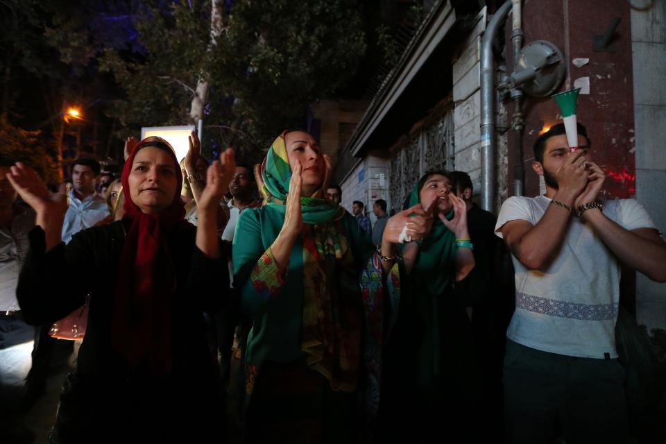 Iranians gather in celebration in northern Tehran on July 14, 2015, after Iran's nuclear negotiating team struck a deal with world powers in Vienna. 