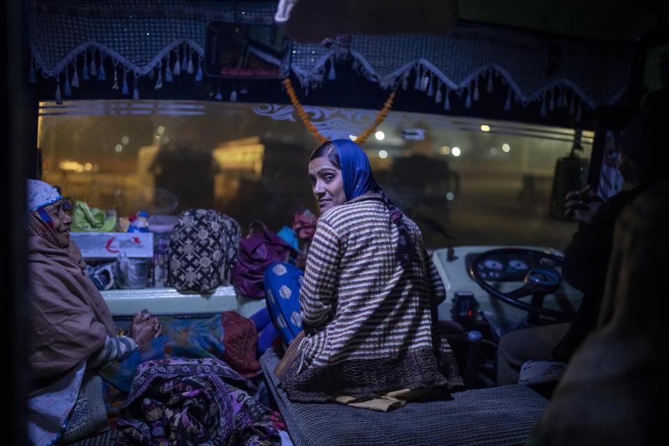 Indian pilgrims wait inside a bus for their departure after visiting Pashupatinath temple in Kathmandu, Nepal, Jan. 12, 2024. The centuries-old temple is one of the most important pilgrimage sites in Asia for Hindus. Nepal and India are the world’s two Hindu-majority nations and share a strong religious affinity. Every year, millions of Nepalese and Indians visit Hindu shrines in both countries to pray for success and the well-being of their loved ones. (AP Photo/Niranjan Shrestha)