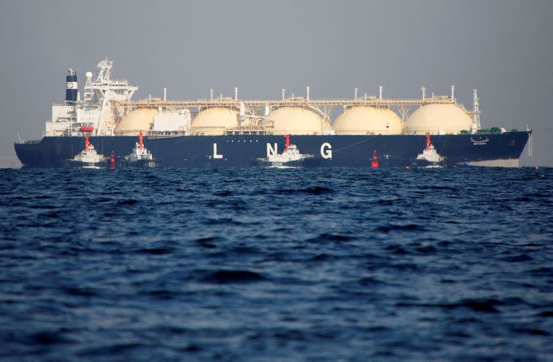 FILE PHOTO: FILE PHOTO: An LNG tanker is tugged towards a thermal power station in Futtsu