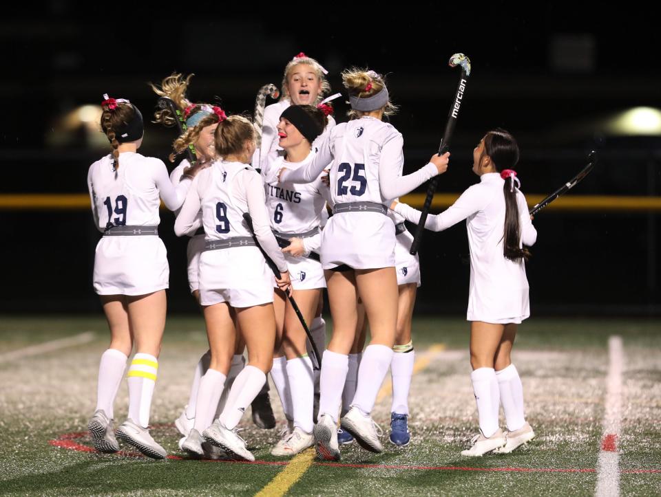 Webster Thomas' team surround Olivia Bottoni, center, and celebrate one of her three goals.