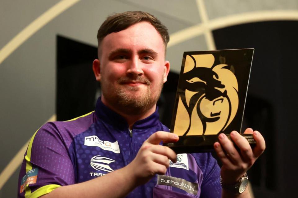 Warrington Guardian: Luke Littler with his trophy after victory in Belfast