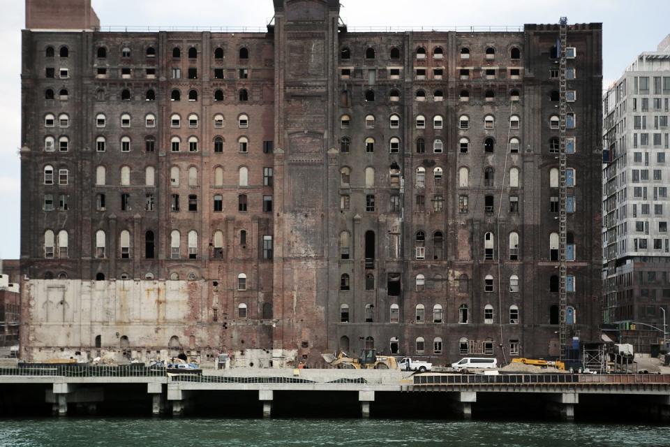 <p>An old Domino Sugar factory sits on the edge of the bustling and trendy Williamsburg neighborhood in Brooklyn. </p>