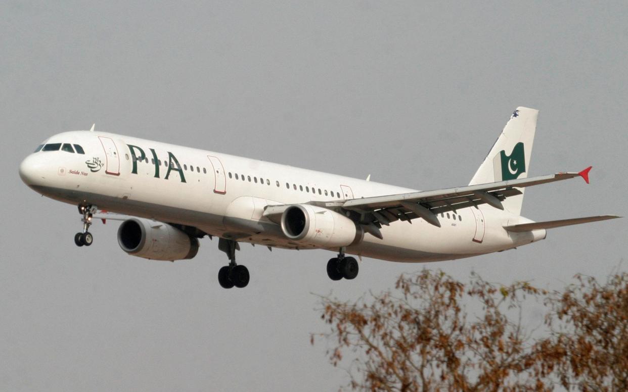 A Pakistan International Airlines plane prepares to land at Islamabad airport in Islamabad - Reuters