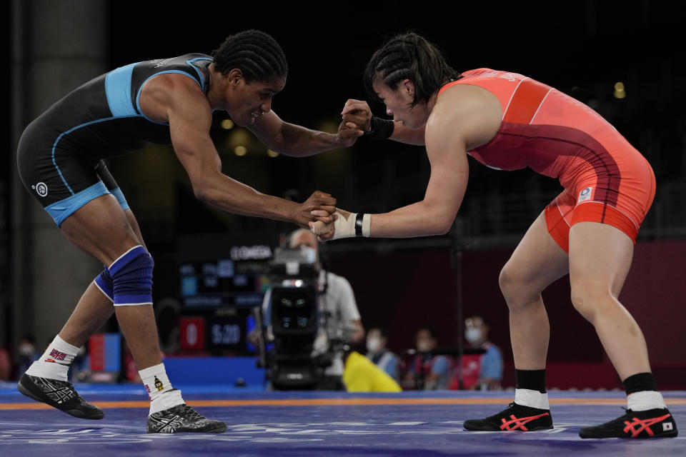 Guinea's Fatoumata Yarie Camara, left, and Japan's Risako Kawai compete during the women's 57kg freestyle wrestling match at the 2020 Summer Olympics, Wednesday, Aug. 4, 2021 in Chiba, Japan. Camara is the only Guinean athlete to qualify for these Games. (AP Photo/Aaron Favila)