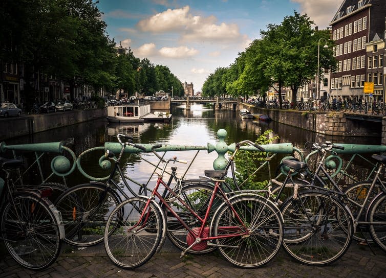 <span class="caption">Cycling is a major mode of transport in the Netherlands.</span> <span class="attribution"><a class="link " href="https://unsplash.com/photos/VEXIwDcY1gw" rel="nofollow noopener" target="_blank" data-ylk="slk:Jace & Afsoon/Unsplash;elm:context_link;itc:0;sec:content-canvas">Jace & Afsoon/Unsplash</a>, <a class="link " href="http://artlibre.org/licence/lal/en" rel="nofollow noopener" target="_blank" data-ylk="slk:FAL;elm:context_link;itc:0;sec:content-canvas">FAL</a></span>