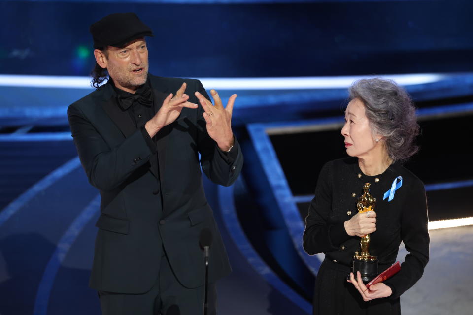 Troy Kotsur received his award from 'Minari' actor Yuh-jung Youn at the Oscars. (Getty)