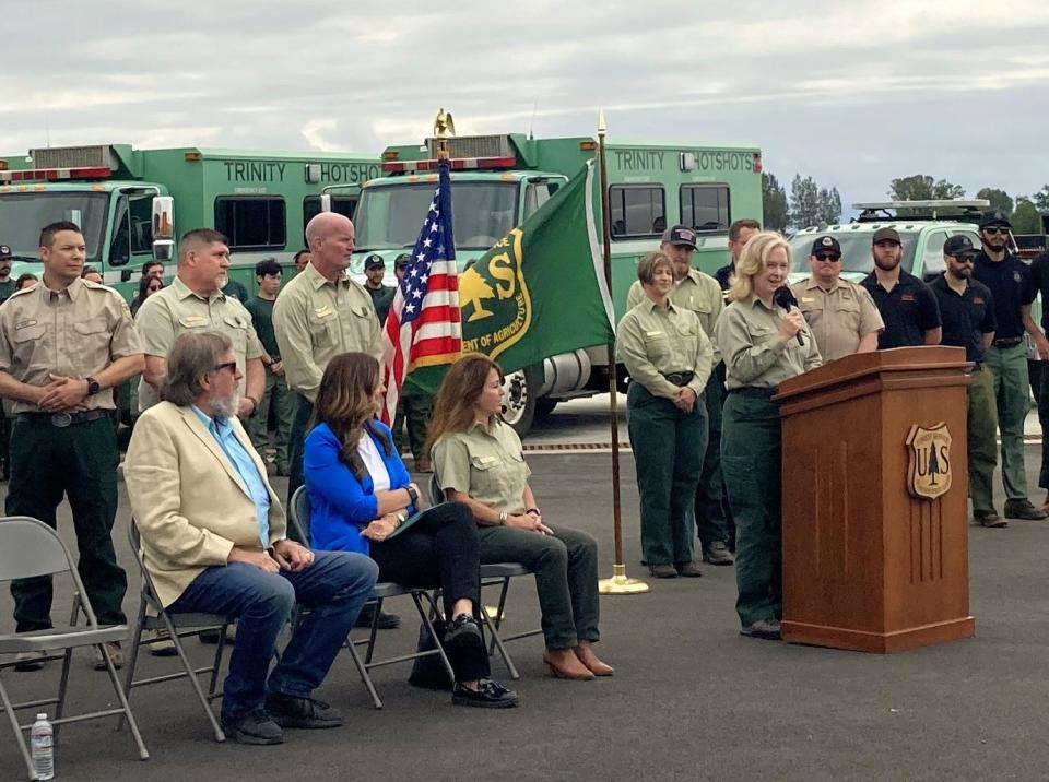 Jennifer Eberlien, U.S. Forest Service regional director, addresses a crowd that came to mark the completion of a $28 million project to expand the firefighting air attack base in Redding on Thursday, April 25, 2024.