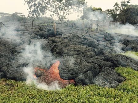 The lava flow from the Kilauea Volcano is seen near the village of Pahoa, Hawaii, October 26, 2014. REUTERS/U.S. Geological Survey/Handout