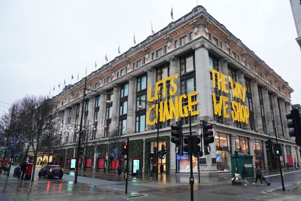 People walk past Selfridges department store on Oxford Street in London (Jonathan Brady/PA) (PA Archive)