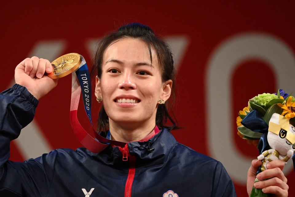 Taiwan's Kuo Hsing-chun shows her gold medal after the victory ceremony of the women's 59kg weightlifting competition during the Tokyo 2020 Olympic Games at the Tokyo International Forum in Tokyo on July 27, 2021. (Photo by Vincenzo PINTO / AFP) (Photo by VINCENZO PINTO/AFP via Getty Images)