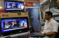 An Afghan man watches the TV broadcast of the U.S. President Donald Trump's speech, in Kabul, Afghanistan August 22, 2017. REUTERS/Omar Sobhani