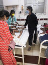 Staff attend to children affected by a gas leak from an LG Polymers plant at the King George hospital in Visakhapatnam on May 7, 2020. - At least five people have been killed and several hundred hospitalised after a gas leak at a chemicals plant on the east coast of India, police said on May 7. They said that the gas had leaked out of two 5,000-tonne tanks that had been unattended due to India's coronavirus lockdown in place since late March. (Photo by - / AFP) (Photo by -/AFP via Getty Images)