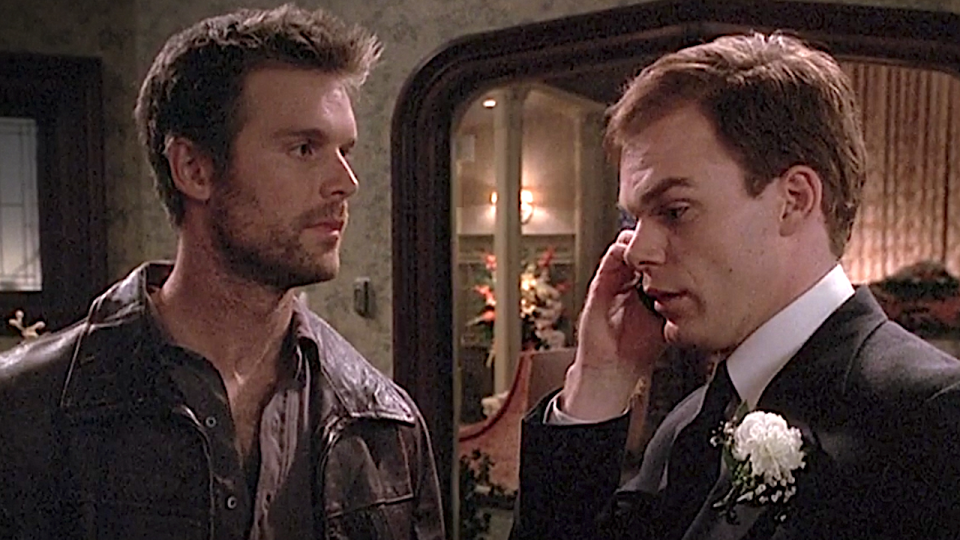 Nate and David talk at a funeral on Six Feet Under.
