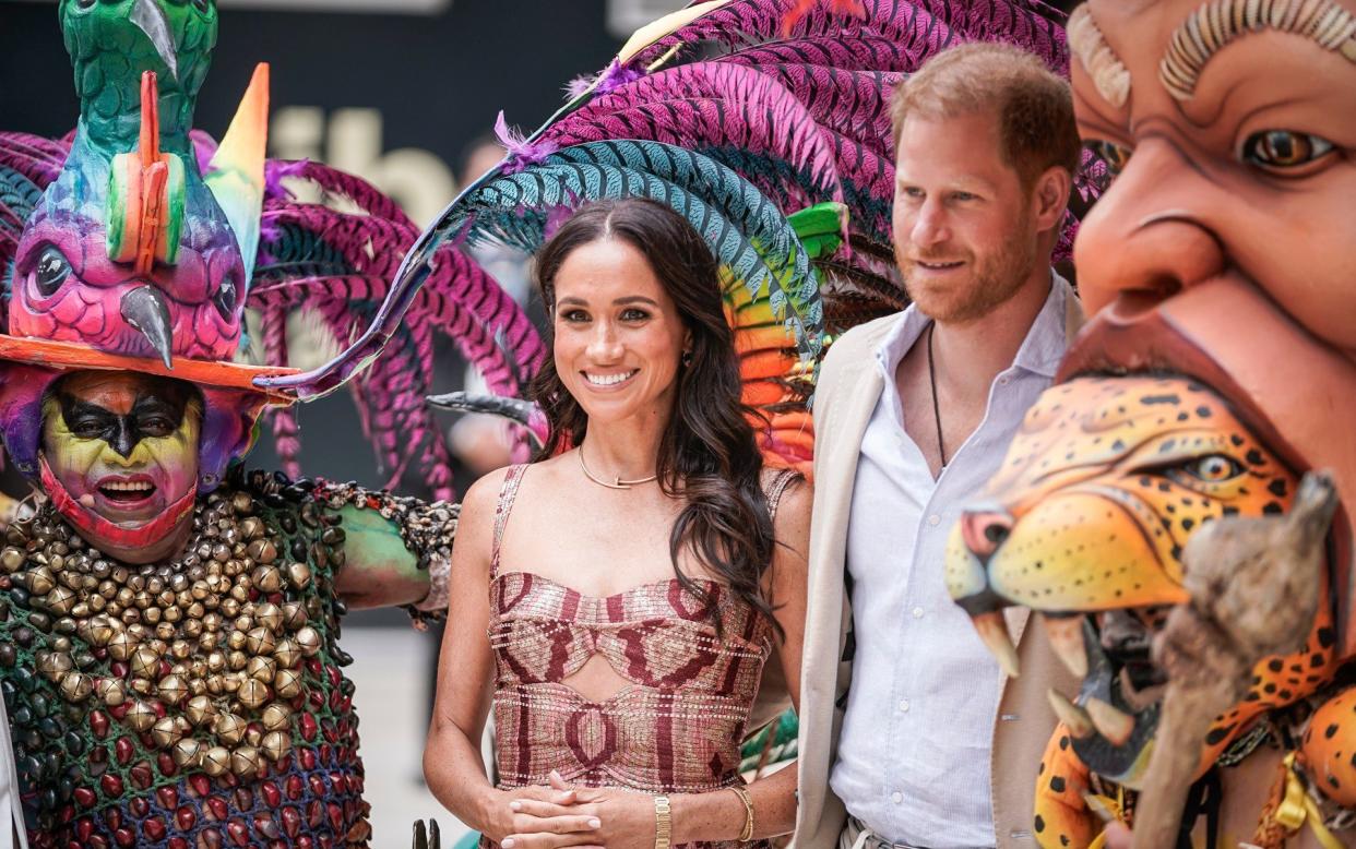 Meghan, Duchess of Sussex and Prince Harry, Duke of Sussex pose for a photo at Centro Nacional de las Artes Delia Zapata during a visit to Colombia