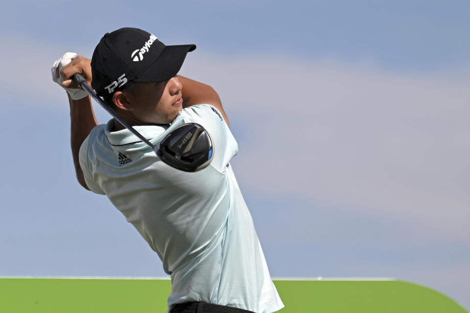 Collin Morikawa watches his tee shot on the first hole during final round of the CJ Cup golf tournament, Sunday, Oct. 17, 2021, in Las Vegas. (AP Photo/David Becker)