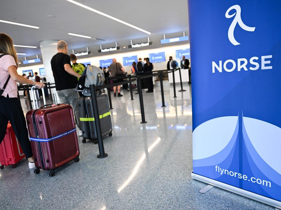 Passengers check-in with Norse Atlantic Airways at LAX on August 10, 2022.