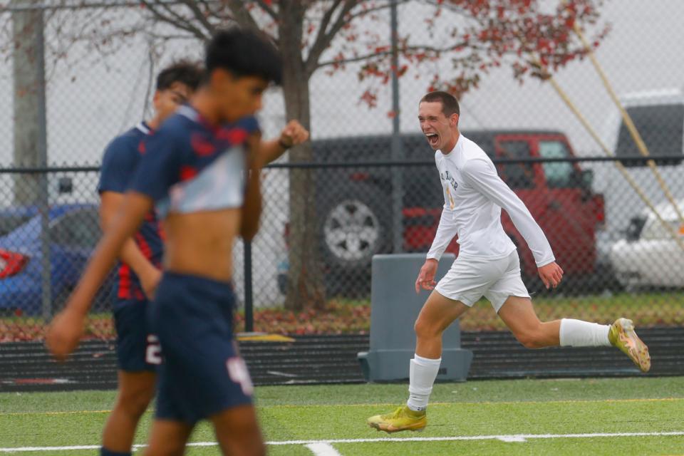 St. Xavier's Beckham Murrow celebrates scoring a goal against Lafayette in the KHSAA state soccer championship.