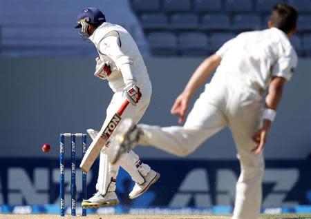 Zaheer Khan misses the ball from New Zealand's Tim Southee (R) during his second innings on day four of the first international test cricket match at Eden Park in Auckland, February 9, 2014. REUTERS/Nigel Marple