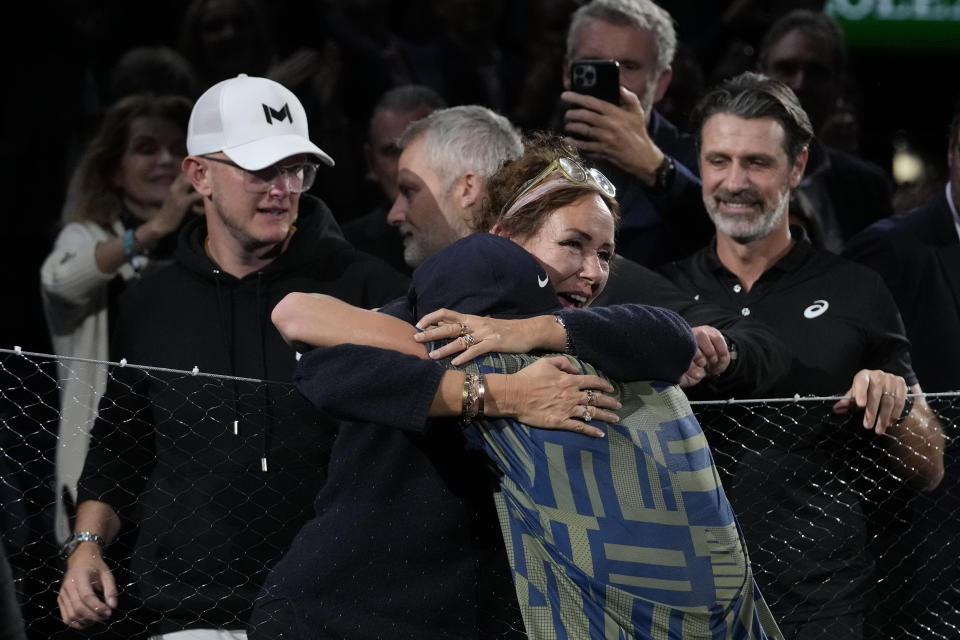 Denmark's Holger Rune is greeted by relatives after defeating Serbia's Novak Djokovic in their Paris Masters final at the Accor Arena, Sunday, Nov. 6, 2022 in Paris. Rune won 3-6, 6-3, 7-5. (AP Photo/Thibault Camus)