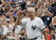 FILE - In this Aug. 2, 2008, file photo, Former New York Yankees picher Don Larsen tips his hat to fans during introduction ceremonies before an old-timers baseball game at Yankee Stadium in New York. Larsen, the journeyman pitcher who reached the heights of baseball glory in 1956 for the Yankees when he threw a perfect game and the only no-hitter in World Series history, died Wednesday night, Jan. 1, 2020. He was 90. (AP Photo/Ed Betz, File)