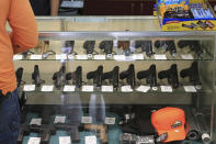 Handguns are on displayed at a gun shop, Thursday, June, 23, 2022 in Honolulu. (AP Photo/Marco Garcia)