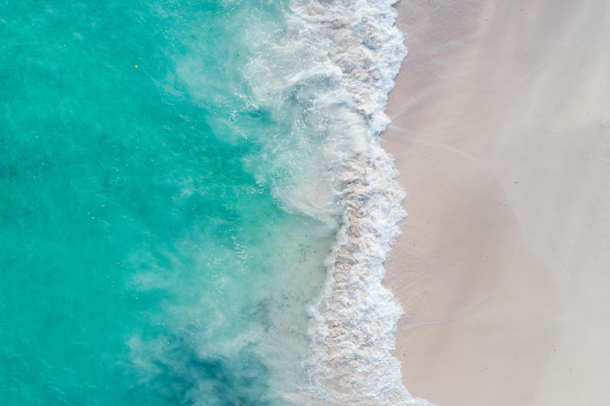 Beach and sea waves shot from above, Barbados