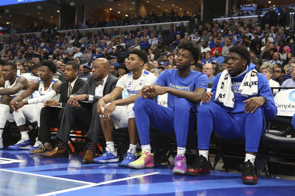 Memphis' James Wiseman, second from right, watches the team's NCAA college basketball game against Arkansas-Little Rock on Wednesday, Nov. 20, 2019, in Memphis, Tenn. (AP Photo/Karen Pulfer Focht)