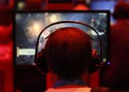 Visitors play "Diablo" during the Gamescom 2012 fair in Cologne August 16, 2012.