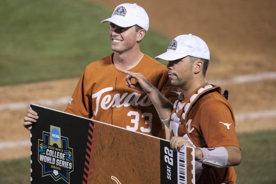 Texas pitcher Pete Hansen, left, and catcher Silas Ardoin celebrate the super regional title after an 11-1 win Sunday over East Carolina. The Longhorns will open this weekend's College World Series against Notre Dame, which upset No. 1 overall seed Tennessee in their super regional, and could draw Texas A&M in the second game.