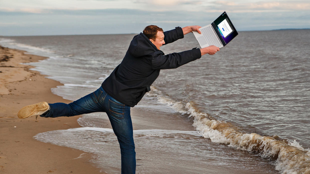  Angry man throws laptop into the sea 