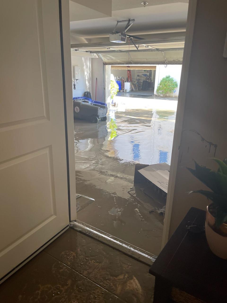 Mud and water seeped into Lydia Duran's garage in the Spanish Walk neighborhood of Palm Desert during Tropical Storm Hilary in August. Seen here is the garage after a crew drained some water from it.