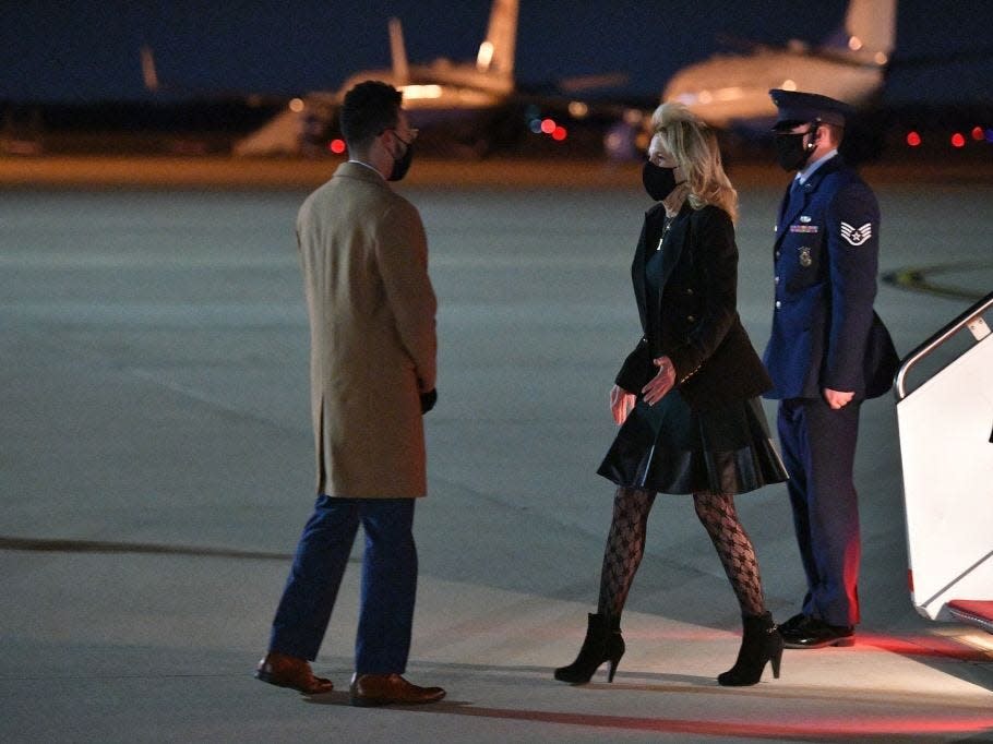 Jill Biden arrives at Andrews Air Force Base wearing black lace tights.