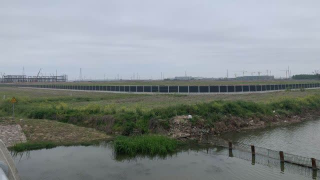 The picture is taken from the southwest side of Gigafactory 3. It shows the first phase only takes up a fraction of the 200-acre land.