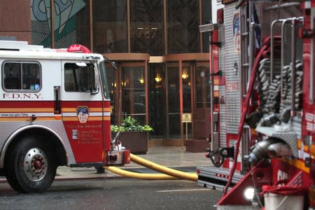 New York City Fire Department trucks outside 787 7th Avenue in midtown Manhattan where helicopter crashed in New York