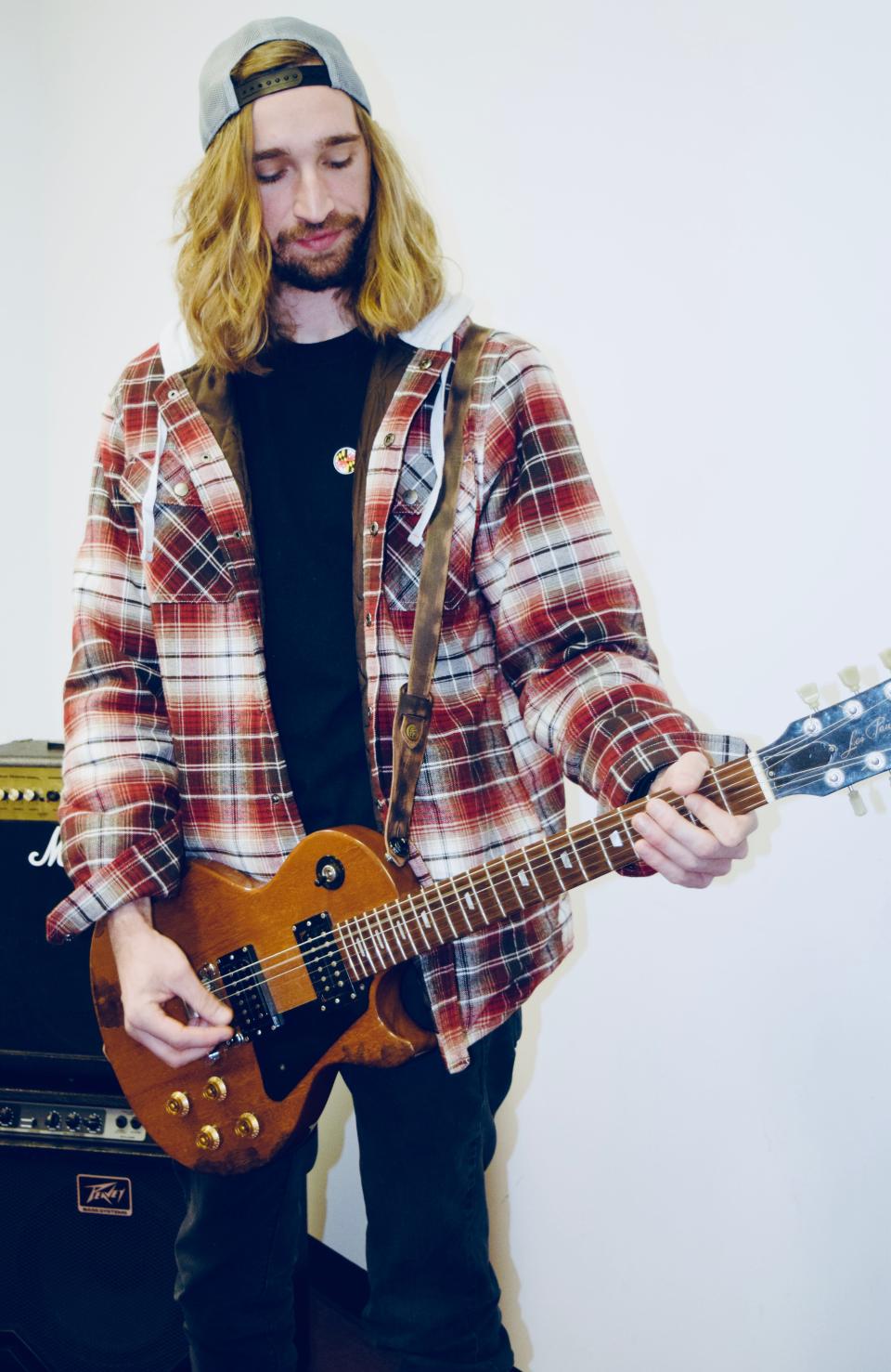 Justin Parks demonstrates his guitar prowess at the Maryland Institute of Music in Halfway. He loves "watching my students grow and go out and do their own thing."