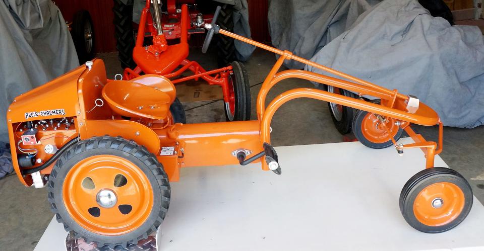 This is one of the pedal cars made by Don Turner of Hokes Bluff modeled after the Allis-Chalmers Model G tractors that were made in Gadsden from 1948 to 1955.
