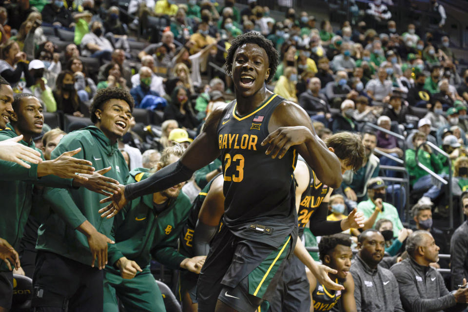 Baylor forward Jonathan Tchamwa Tchatchoua (23) celebrates in the second half against Oregon during an NCAA college basketball game in Eugene, Ore., Saturday, Dec. 18, 2021. (AP Photo/Thomas Boyd)