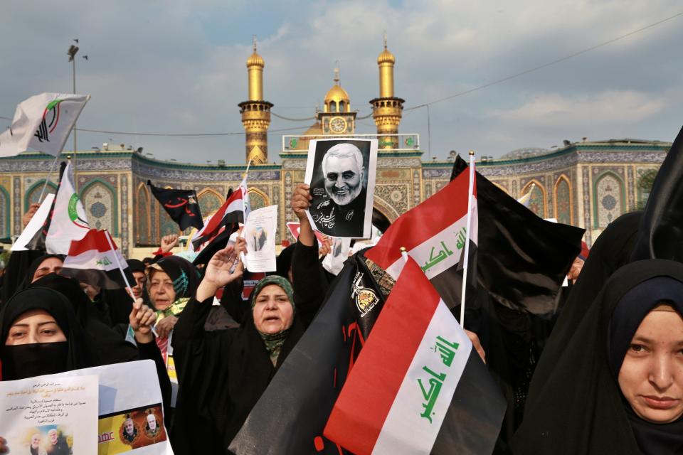 FILE - In this Saturday, Jan. 4, 2020 file photo, Shiite Muslims demonstrate over the U.S. airstrike that killed Iranian Revolutionary Guard Gen. Qassem Soleimani, shown in posters, in Karbala, Iraq. Iraqi militia leaders were expecting the usual bags of cash when the new head of Iran's expeditionary Quds Force , a successor Soleimani, paid his first visit. Instead, Esmail Ghani brought them silver rings, as tokens of gratitude. The episode, relayed by several officials, illustrates Iran's struggle to maintain influence abroad as it grapples with the economic fallout from crushing U.S. sanctions and the coronavirus. (AP Photo/Khalid Mohammed, File)