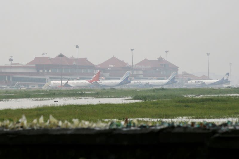 Planes are seen parked inside the flooded Cochin international airport following heavy rain, on the outskirts of Kochi