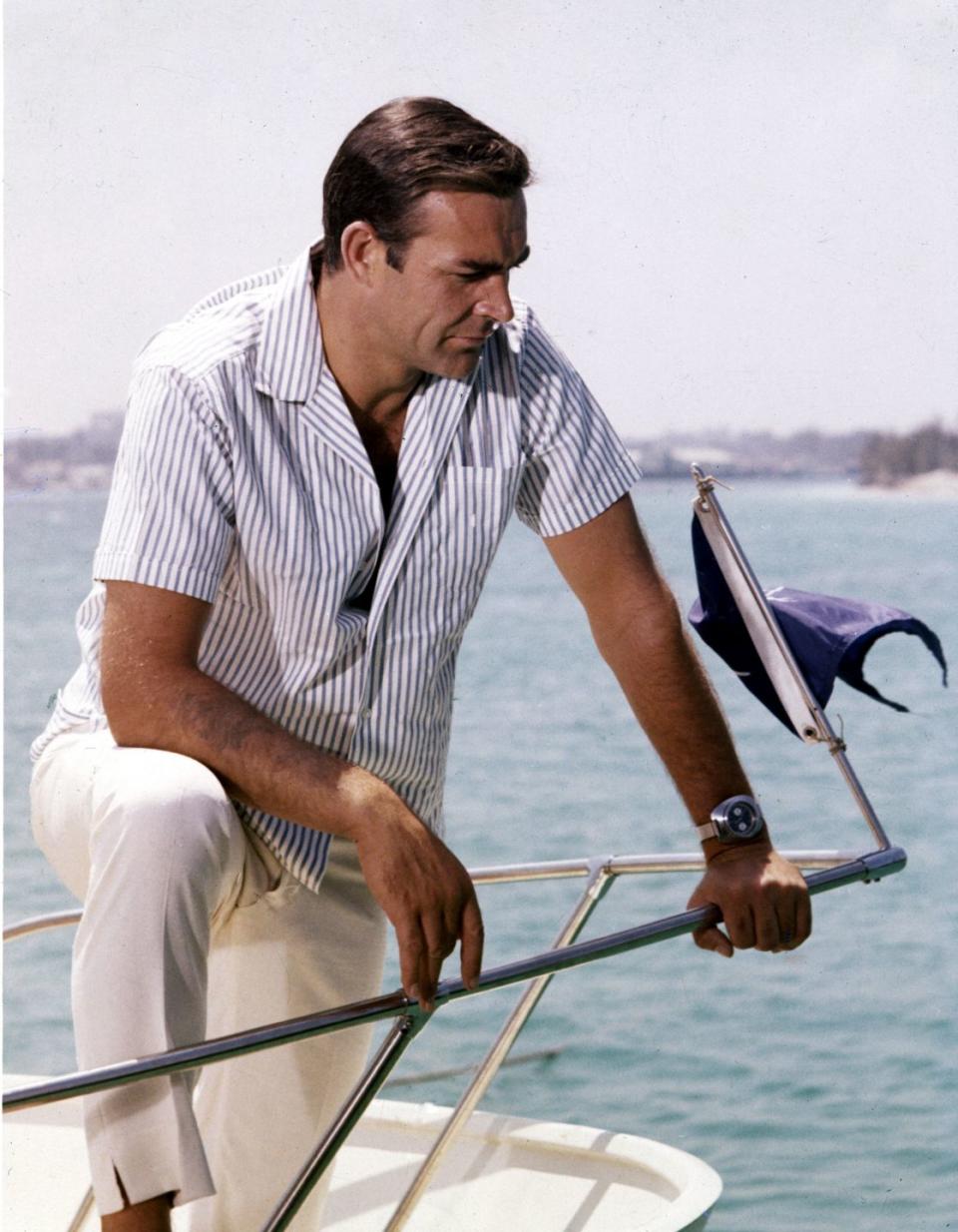 <p>Sean Connery leans over the bow of a small motorboat in 1970. </p>