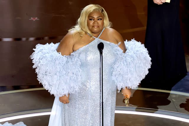 <p>Kevin Winter/Getty Images</p> Da'Vine Joy Randolph accepts the Best Supporting Actress award at the 2024 Oscars