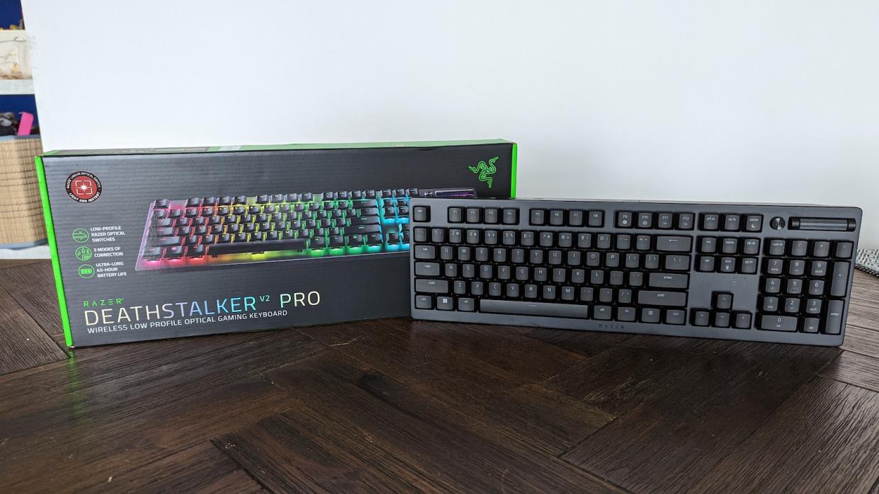A low profile mechanical keyboard, the Razer DeathStalker V2 Pro, with its packaging on a wooden table. (Photo: Yahoo Gaming SEA)