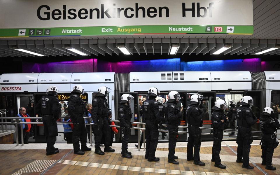 Riot police stand in Hauptbahnhof main railway station prior to the Group C England v Serbia match in Gelsenkirchen